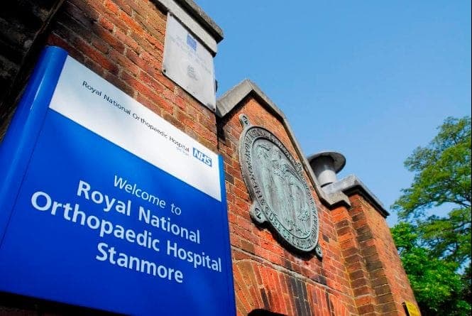 “Welcome to Royal National Orthopaedic Hospital Stanmore” sign on the hospital's brick entrance building